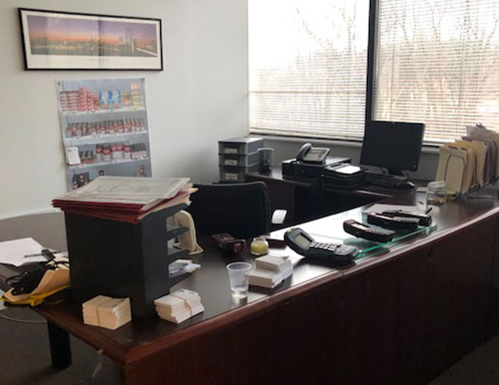 A cluttered desk in an office