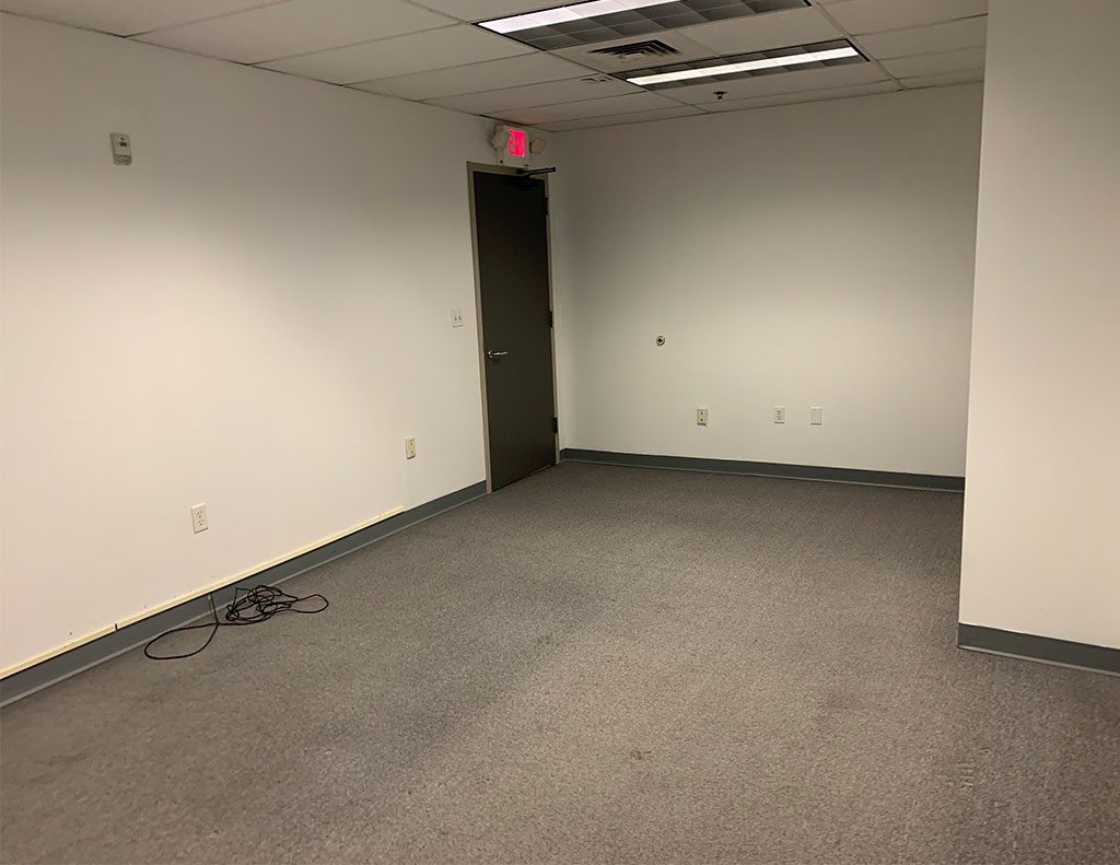 An empty room with an exit door